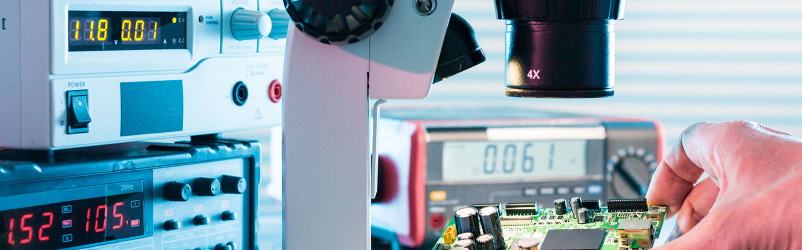 QUALITY CONTROL | Microelectronics laboratory with the measuring instruments and microscopes. electronic circuit board in hand